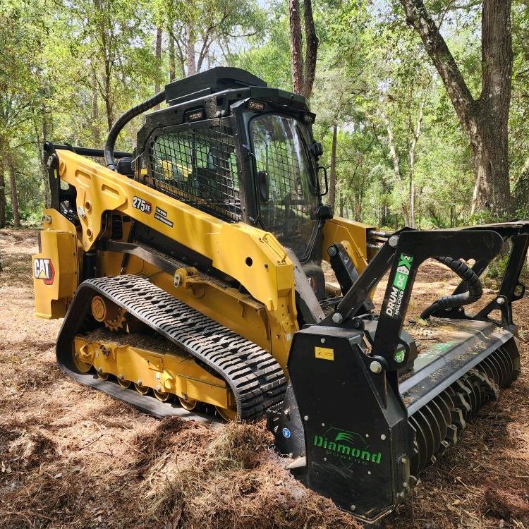 Operator using specialized mulching equipment to clear dense brush with controlled precision 2