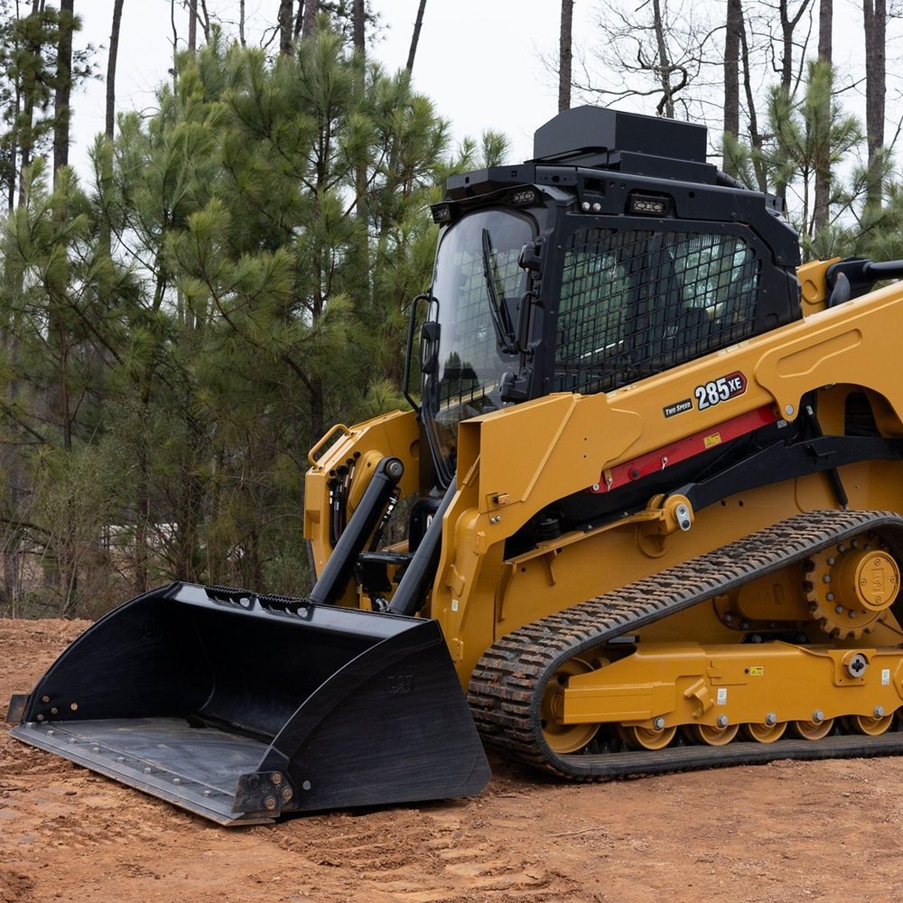 Operator assessing terrain and clearing obstacles for precise site preparation work